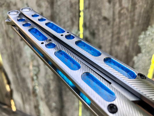 Extend and protect the handles of your Geof Dumas Ex10 and Ex11 balisongs with these Zippy extensions, which offer adjustable balance. Handle inlays modify the grip and sound.