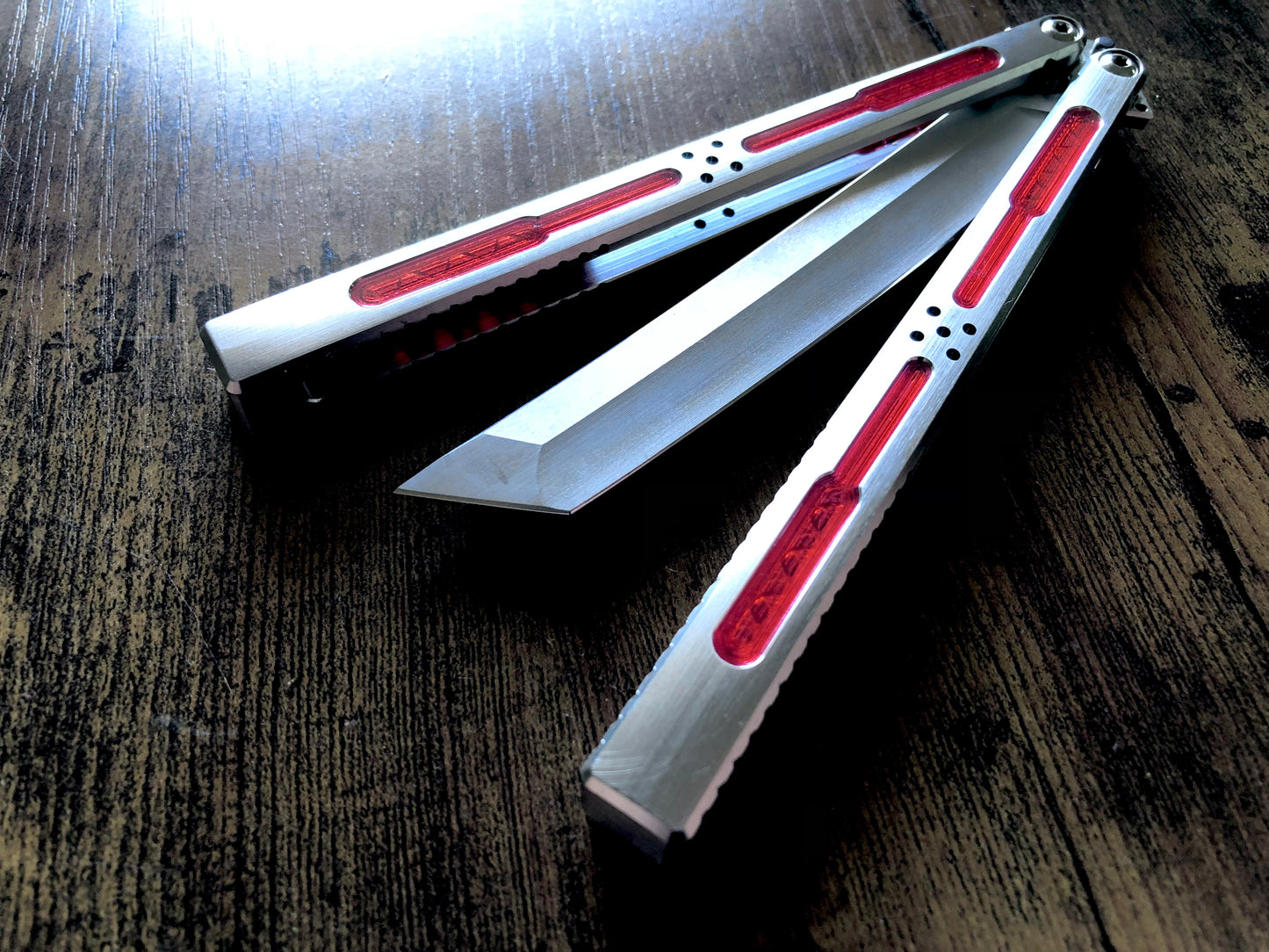 Modify the grip, silence the ring, and deepen the sound of your Tormentum Azoth balisong with these polyurethane Zippy handle inlays.