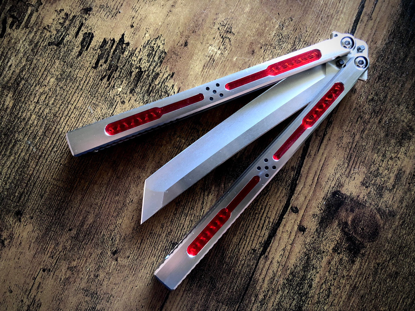 Modify the grip, silence the ring, and deepen the sound of your Tormentum Azoth balisong with these polyurethane Zippy handle inlays.