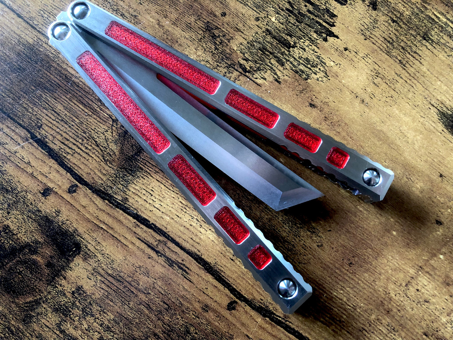 Modify the ergo, deepen the sound, and add a pop of color to your B.A. Balis Tesseract balisong with these polyurethane Zippy handle inlays.