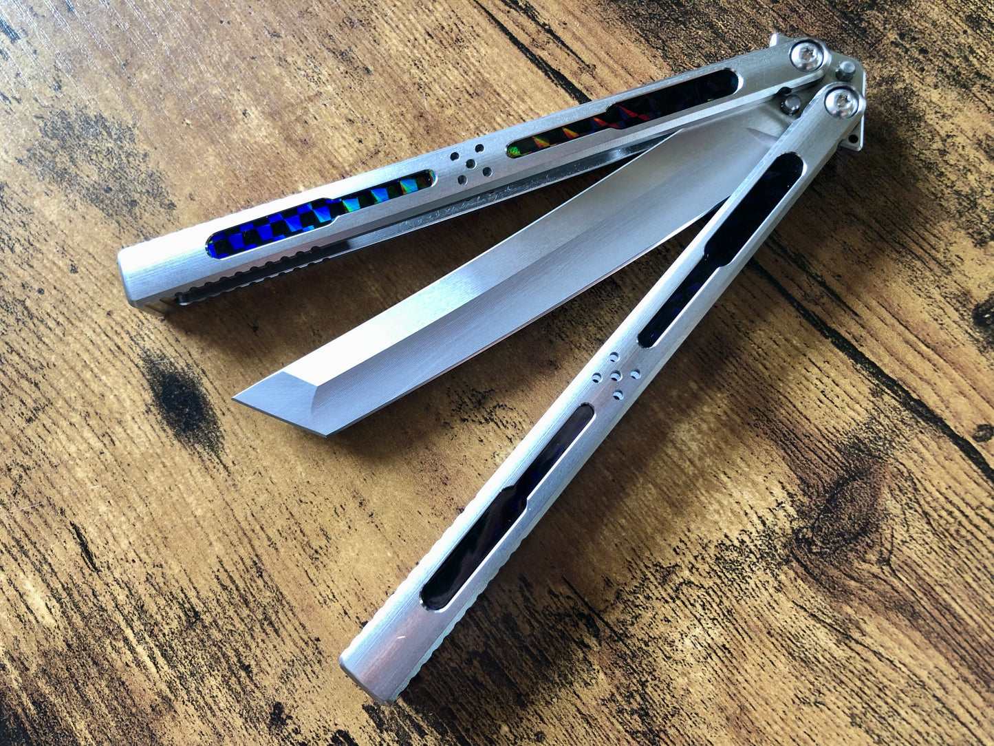 Modify the grip, silence the ring, and deepen the sound of your Tormentum Azoth balisong with these polyurethane Zippy handle inlays.