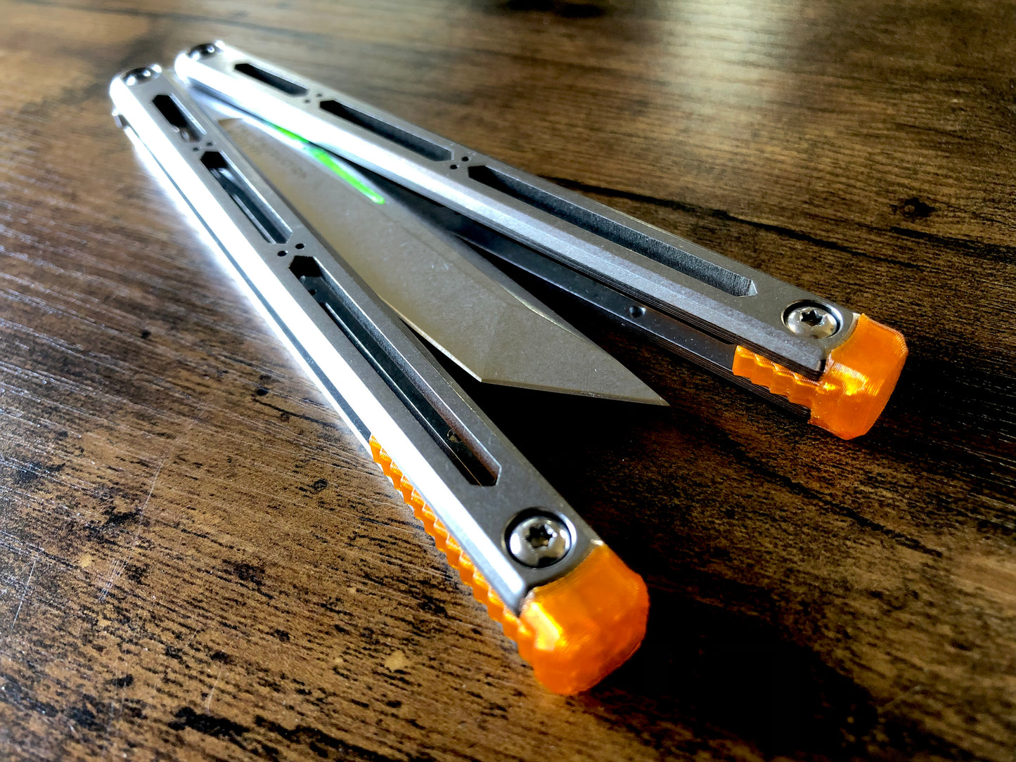 These Zippy spacers designed for the Squid Industries Hydro Balisong are made in-house from a rubbery, shatter-proof polyurethane. They add positive "sawtooth" jimping to the Hydro and are available as either full-length flush spacers for a more neutral balance, or handle extensions (with an adjustable tungsten weight system) to protect the handles from drops and increase momentum. A cosmetic blade insert is included.