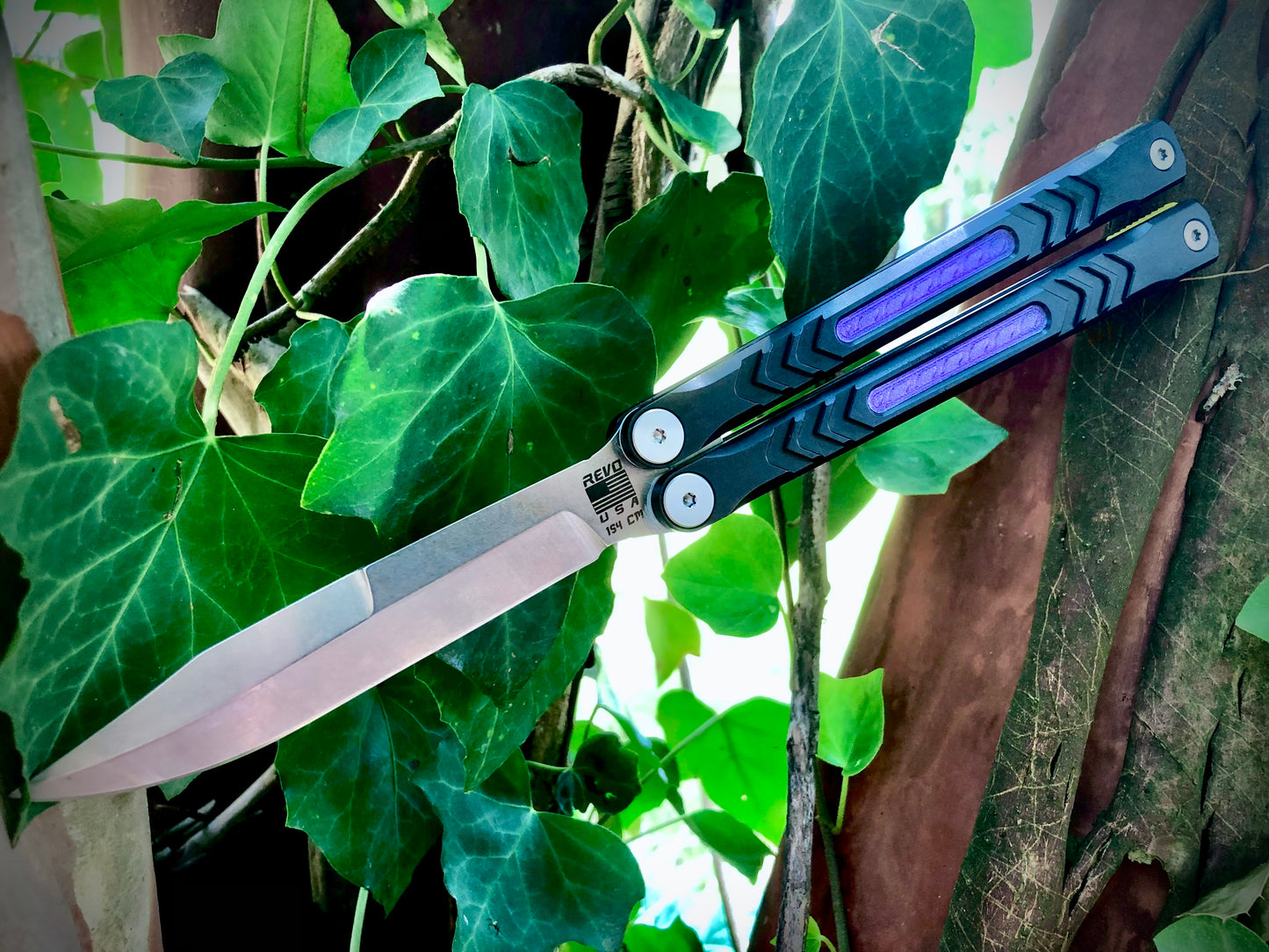 Reduce the handle bias and add grip to your Revo Nexus balisong with Zippy handle inlays and lightweight spacers featuring positive jimping.