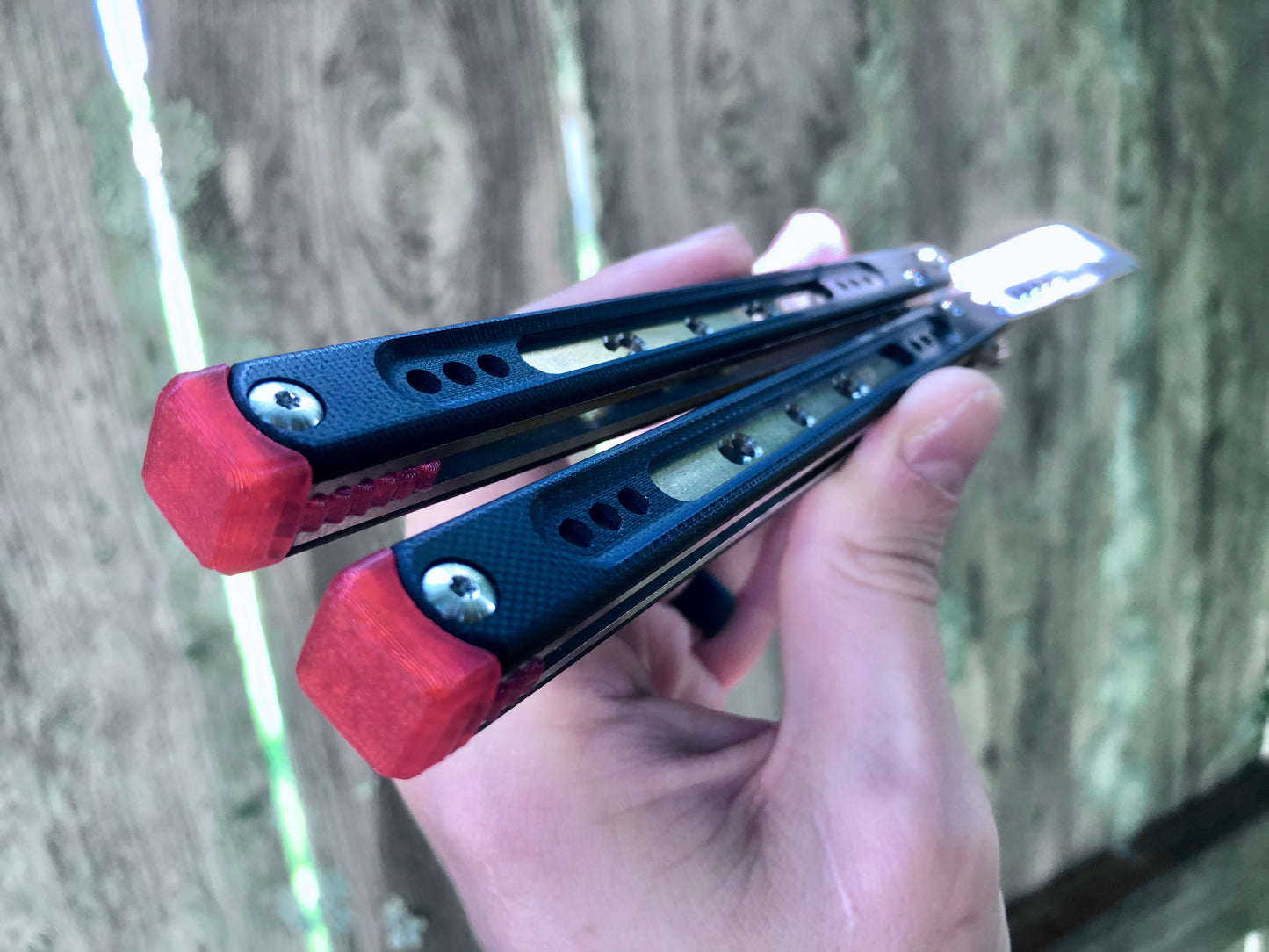These Black Balisong Rebola v2 spacers are made in-house from a rubbery, shatter-proof polyurethane. They are ultra-lightweight extension spacers that reduce the stock handle-bias. They also feature positive sawtooth jimping and enable adjustable balance with up to 1x removable tungsten weight per spacer.