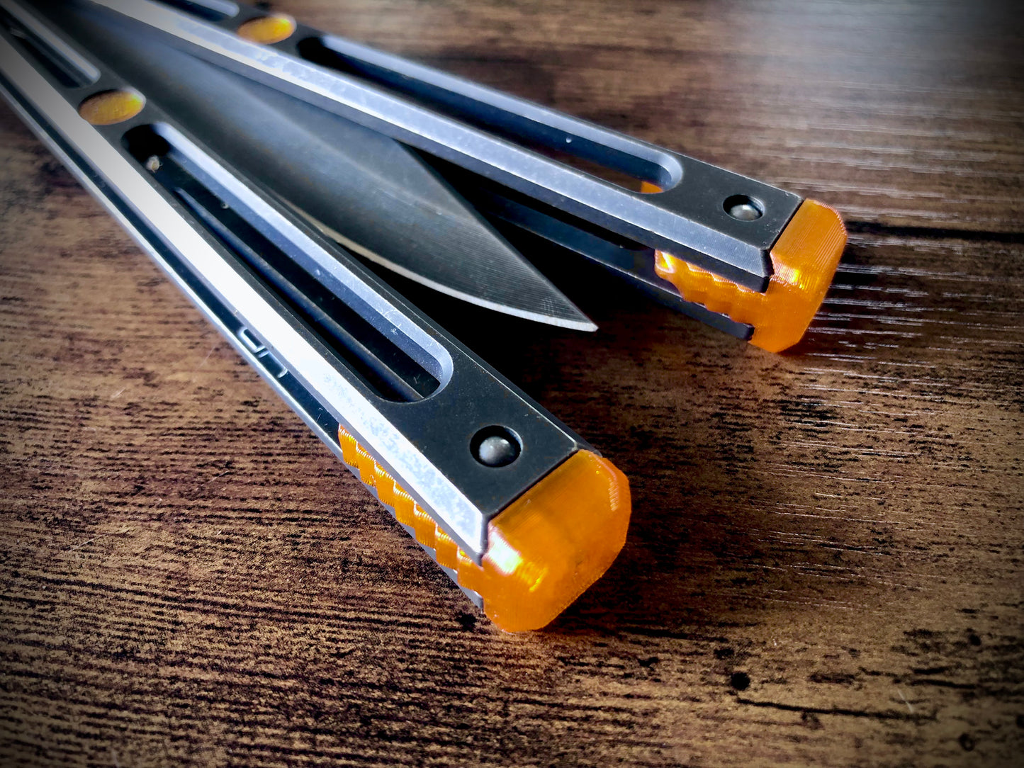 Extend and protect your handles with these Zippy spacers, custom-made for the Goose balisong (designed by Arthur Goins and machined by JK Design). The spacers are made from a shatter-proof polyurethane and protect your handles from drops while adding length. The spacers also feature positive sawtooth jimping and adjustable balance.
