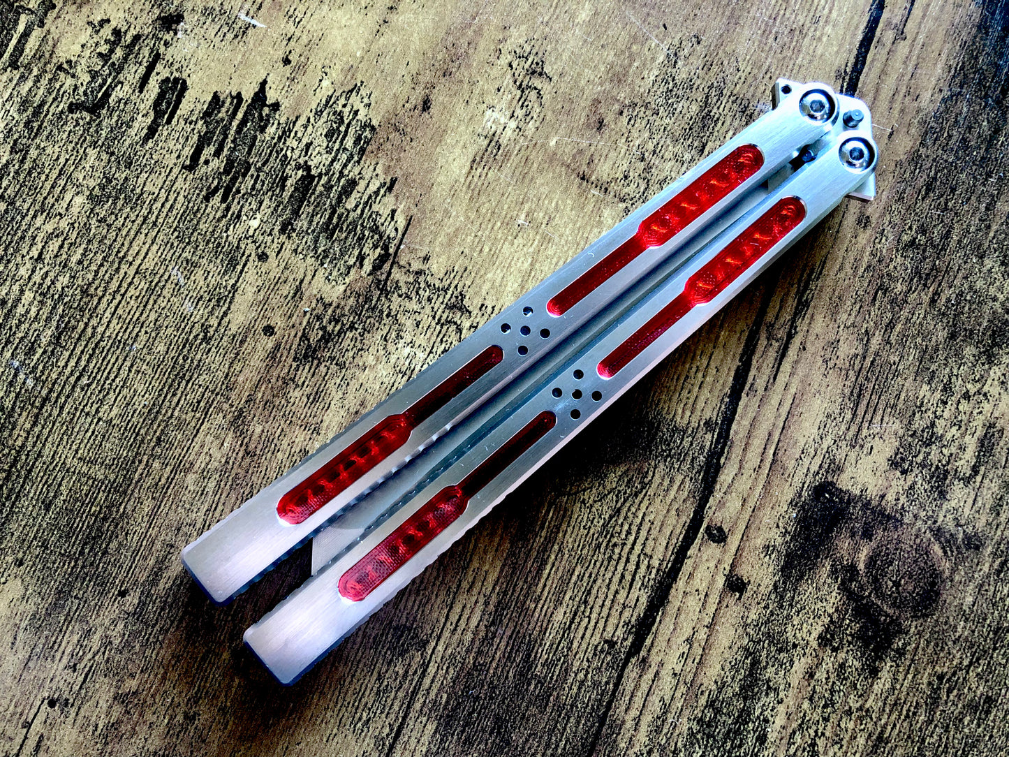 Modify the grip, silence the ring, and deepen the sound of your Tormentum Azoth balisong with these polyurethane Zippy handle inlays.