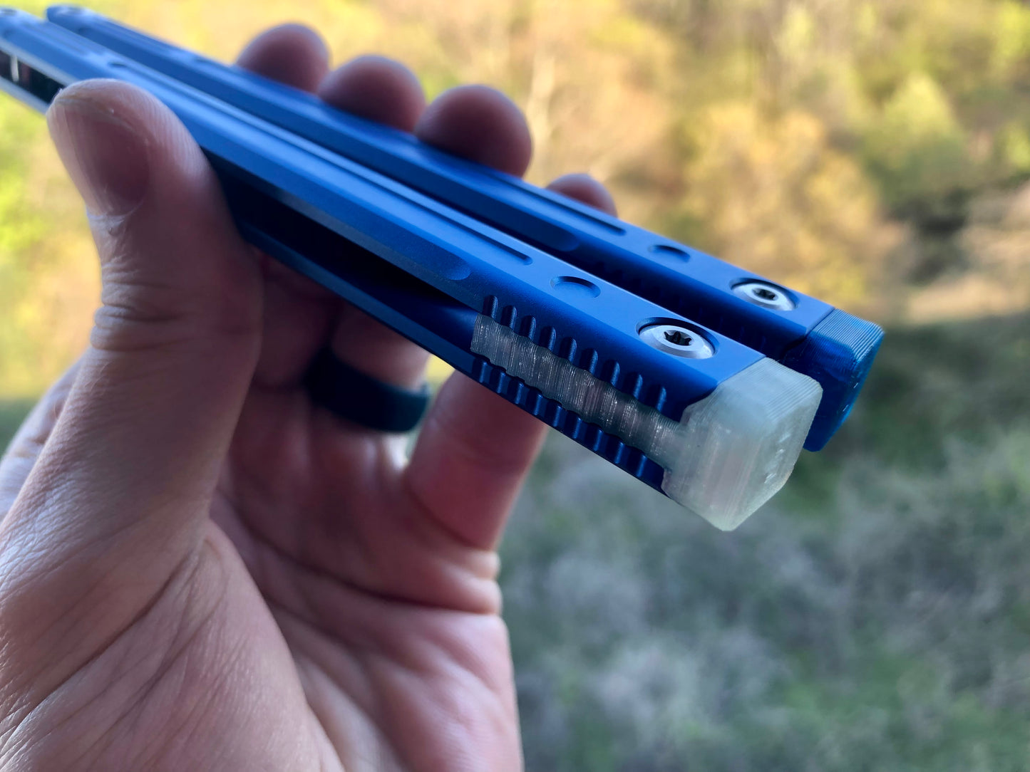 Adjust the balance, extend the handles, and add grip to your LDY balisong Cygnus and Orion flippers with Zippy extension spacers and handle inlays.