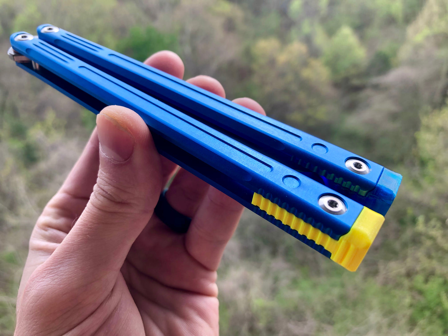 Adjust the balance, extend the handles, and add grip to your LDY balisong Cygnus and Orion flippers with Zippy extension spacers and handle inlays.