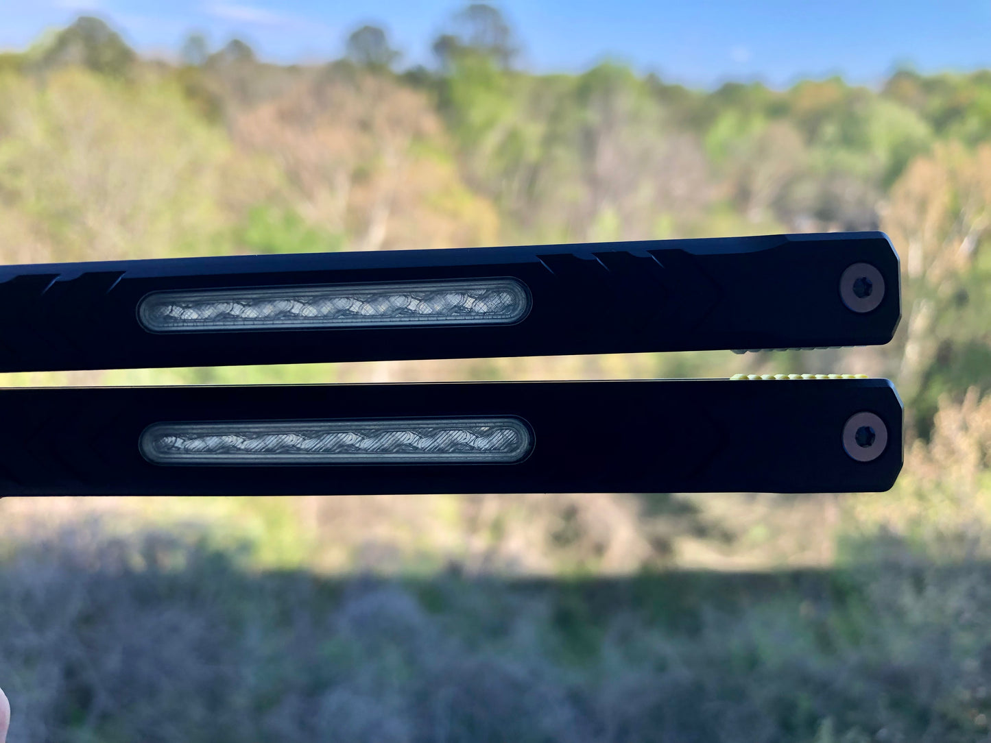 Reduce the handle bias and add grip to your Revo Nexus balisong with Zippy handle inlays and lightweight spacers featuring positive jimping.