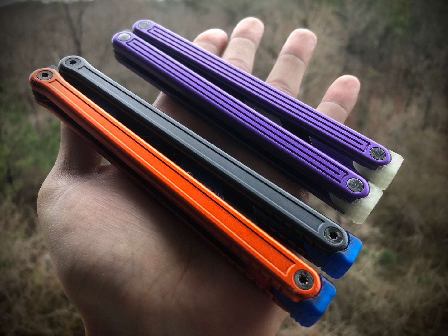 Reduce the handle bias and adjust the balance of your Glidr Arctic, Antarctic, and Bermuda balisong trainers with tungsten-weighted Zippy blade inserts and spacers featuring adjustable balance and positive jimping.