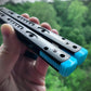 Reduce the handle bias and improve the flipping of your Ryworx Omeme balisong with Zippy extension spacers that feature adjustable balance and positive jimping.
