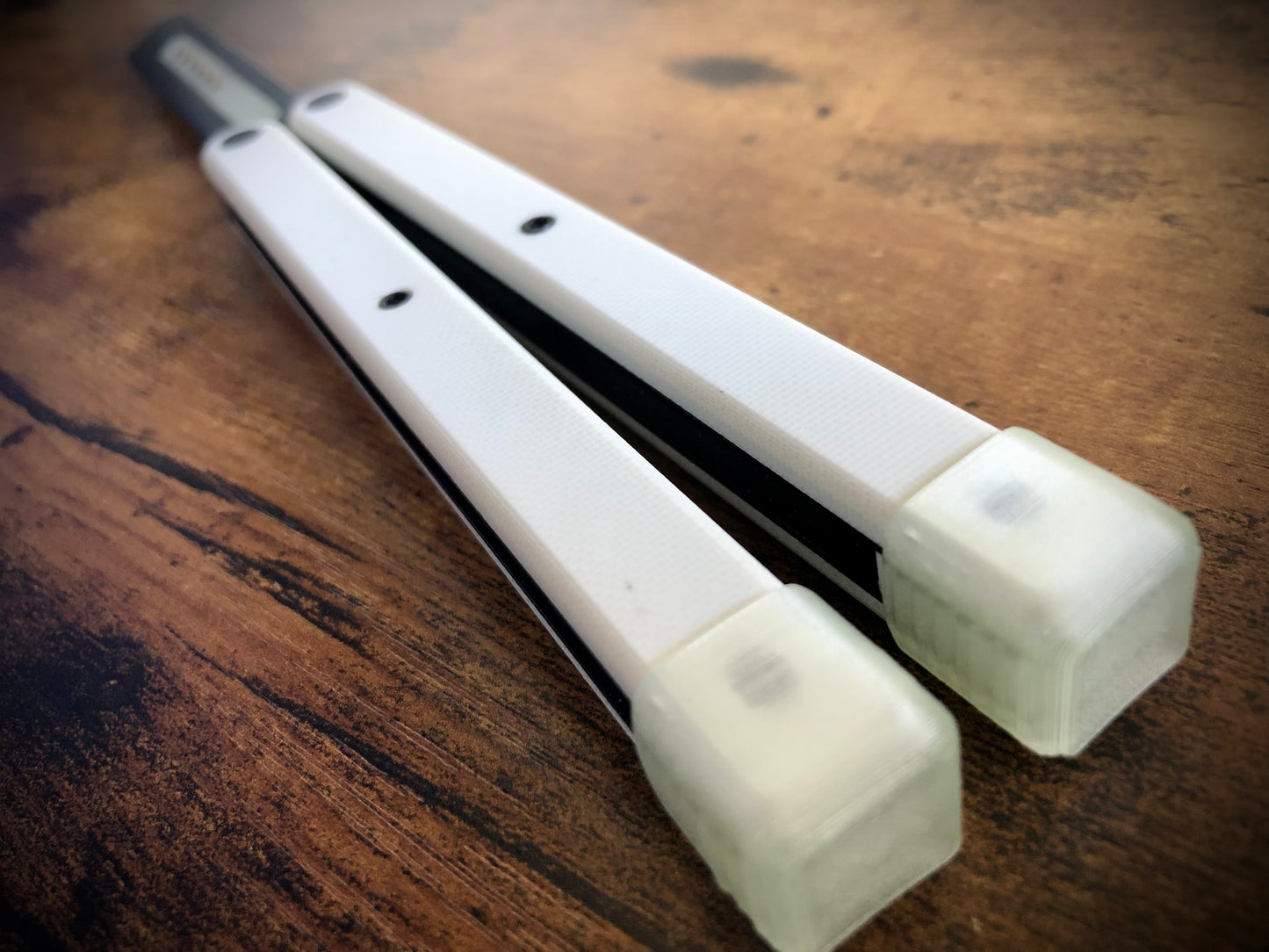 Reduce the handle bias and adjust the balance of your Glidr Arctic, Antarctic, and Bermuda balisong trainers with tungsten-weighted Zippy blade inserts and spacers featuring adjustable balance and positive jimping.