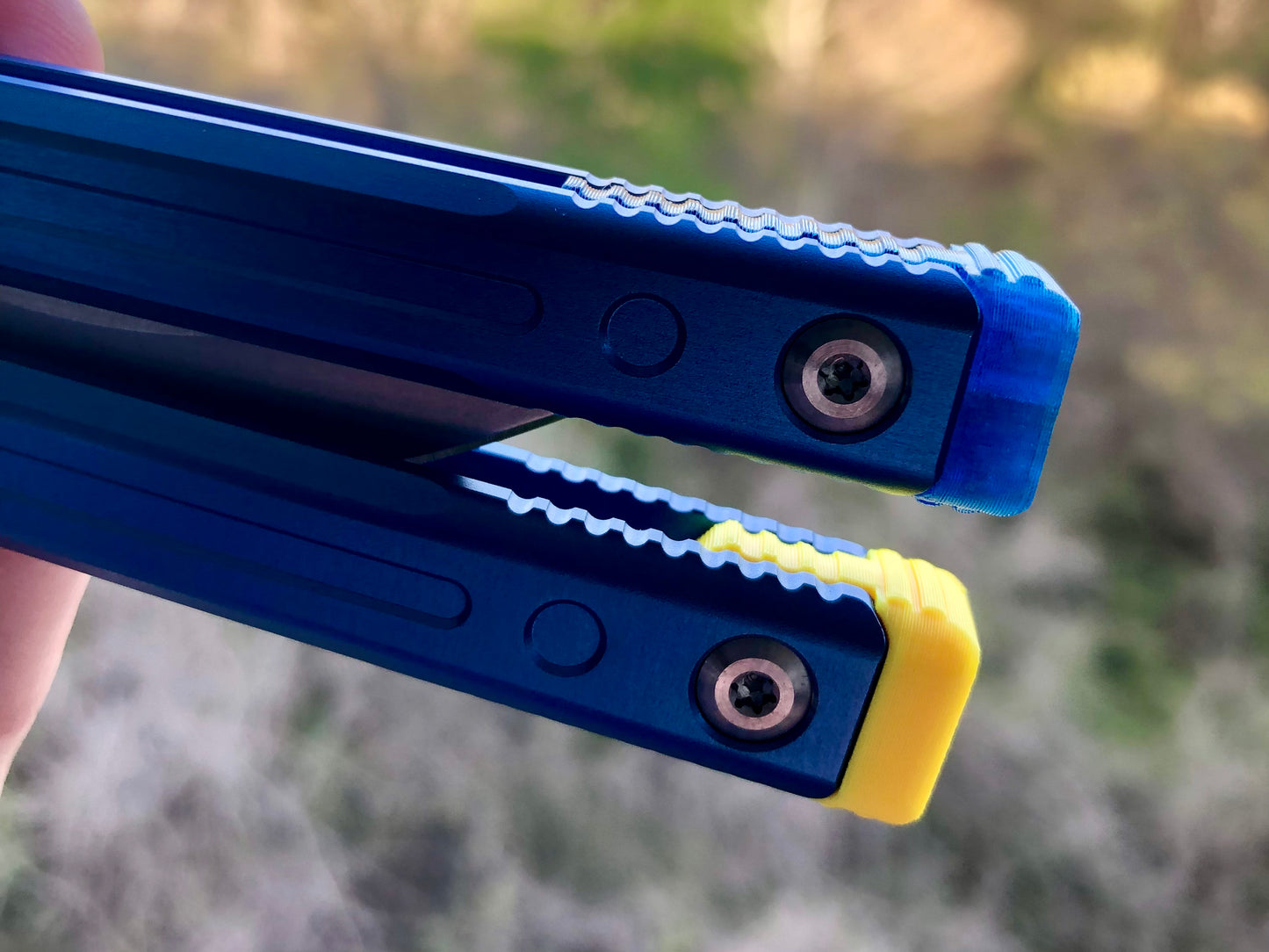 Adjust the balance, extend the handles, and add grip to your LDY balisong Cygnus and Orion flippers with Zippy extension spacers and handle inlays.