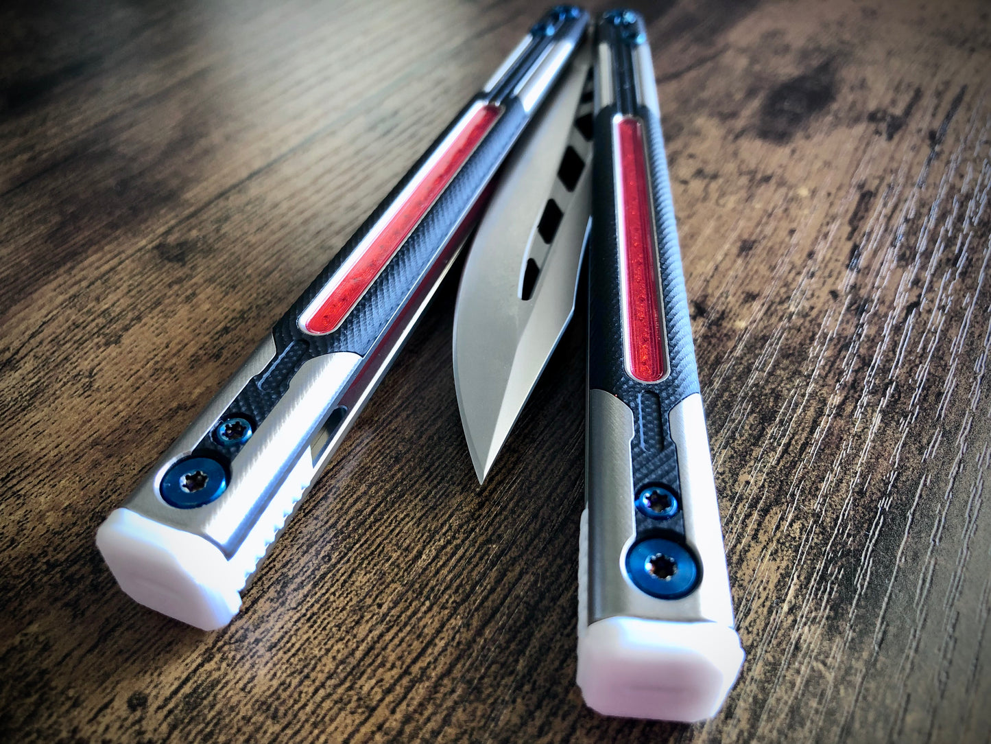 Adjust the balance, extend the handles, and add grip to your LDY balisong Cygnus and Orion flippers with Zippy extension spacers and handle inlays.