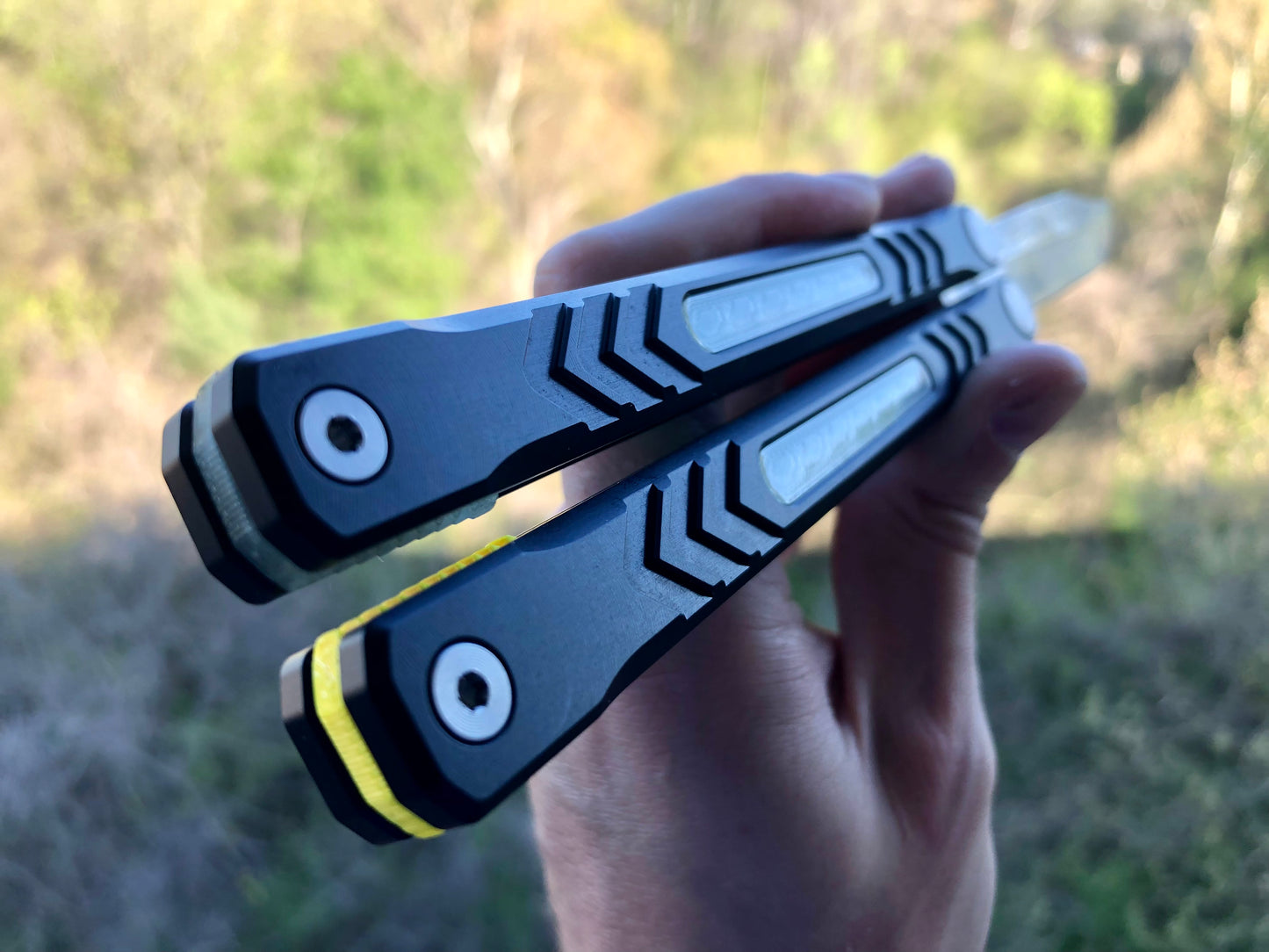 Reduce the handle bias and add grip to your Revo Nexus balisong with Zippy handle inlays and lightweight spacers featuring positive jimping.