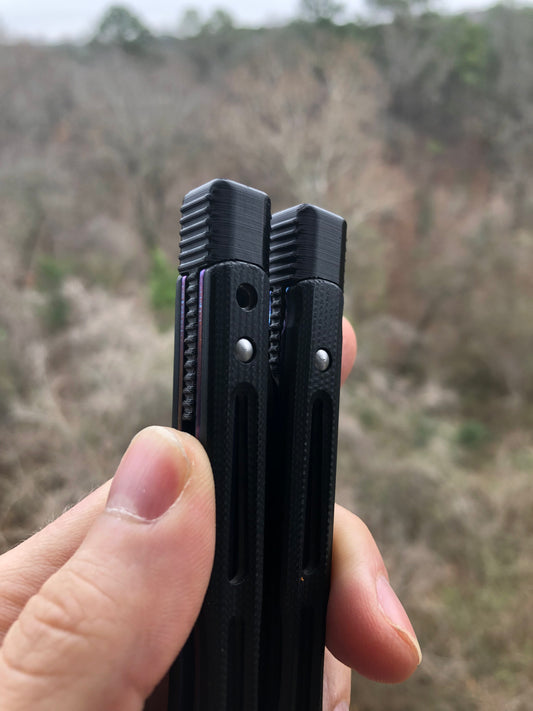 Cousin to Jimpy's discontinued Space Invaders, these Zippy Benchmade 51 spacers are made from a shatter-proof polyurethane with jimping. They extend and protect the handles of the BM 51, and enable adjustable balance with removable tungsten weights.