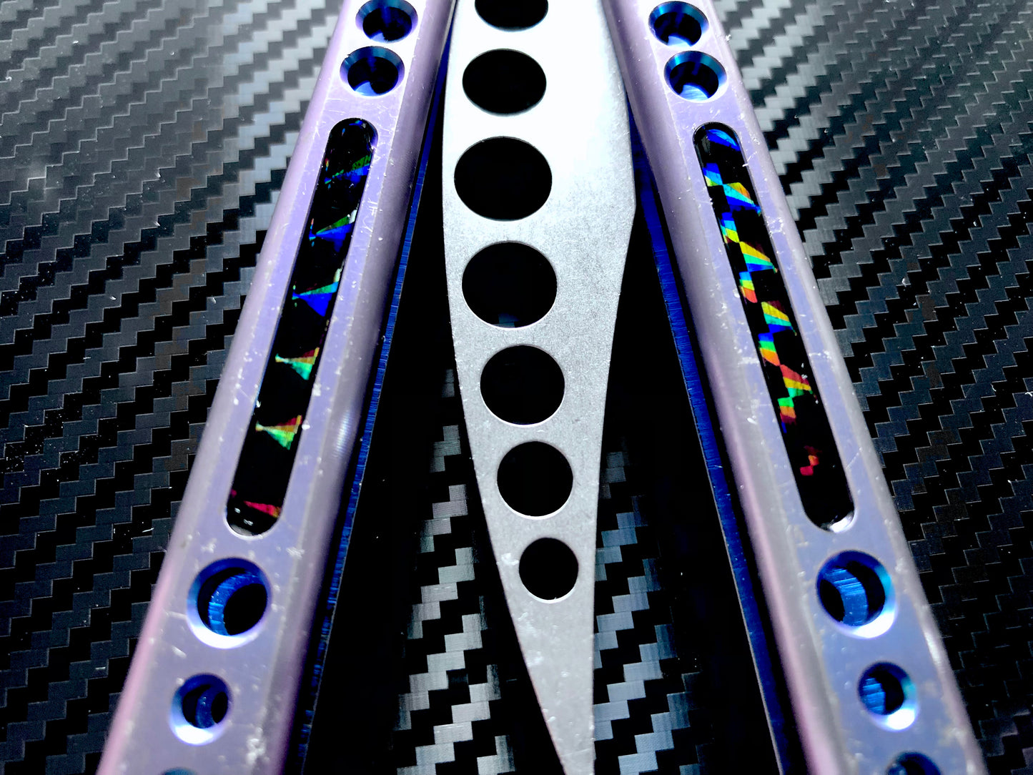 Deepen the sound, modify the grip, and add a pop of color to your HOM Prodigy Mod C balisong trainer with these polyurethane Zippy handle inlays.