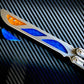 Deepen the sound, silence the ring and adjust the weight distribution of your Nabalis Canyon balisong these custom-made Zippy inlays. This mod consists of (1) speed channel inlays which silence 90% of the ring; as well as optional (2) jimping plugs which silence the ring and house a removable tungsten weight for handle-bias lovers; and (3) optional trainer blade inserts to add tip-weight and a pop of color.