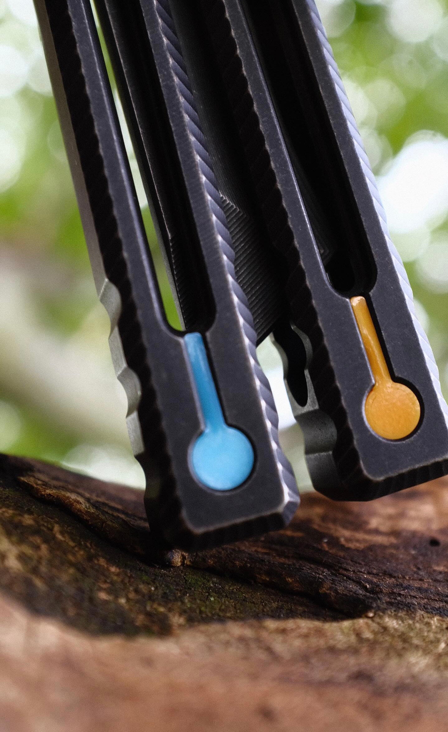 Pivot Plugs are a cosmetic handle inlay mod designed to friction fit into 3/16" bores at the bottom of a variety of balisong handles, including the Squid Industries Krake Raken balisong, the MachineWise Prysma, SliftT, the Nabalis Vulp Pro, and the Acidwrx Zzzyzx.