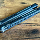 The Parallax is Zippy's first metal balisong, featuring and a modular spacer system that enables rapid adjustment of handle length and balance. The innovative triple-liner design and channel scales provide enhanced rigidity compared to traditional sandwich-style balisongs. The Parallax features threadlocker-free tuning and the high-performance raceway bearing system, which is slower and more controlled compared to traditional bearings.