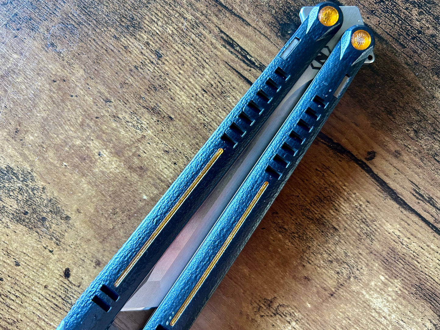 Want to kit out your Zippy Parallax butterfly knife with a different aesthetic? Look no further. This listing allows you to customize your balisong with different colored handle inlays and pivot caps. These cosmetic inlays are made in-house from a rubbery, shatter-proof polyurethane.