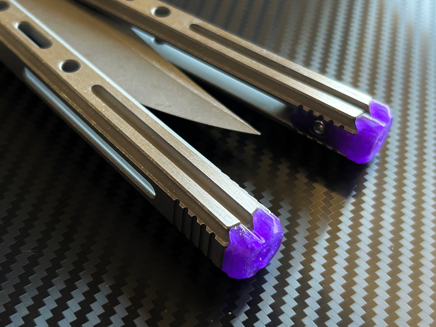 Extend and protect your handles with these Zippy spacers, custom-made for the Poikilo Blade PM3 (Halo) butterfly knife. The spacers are made from a shatter-proof polyurethane and protect your handles from drops while adding length. The spacers improve comfort. grip, and offer adjustable balance.