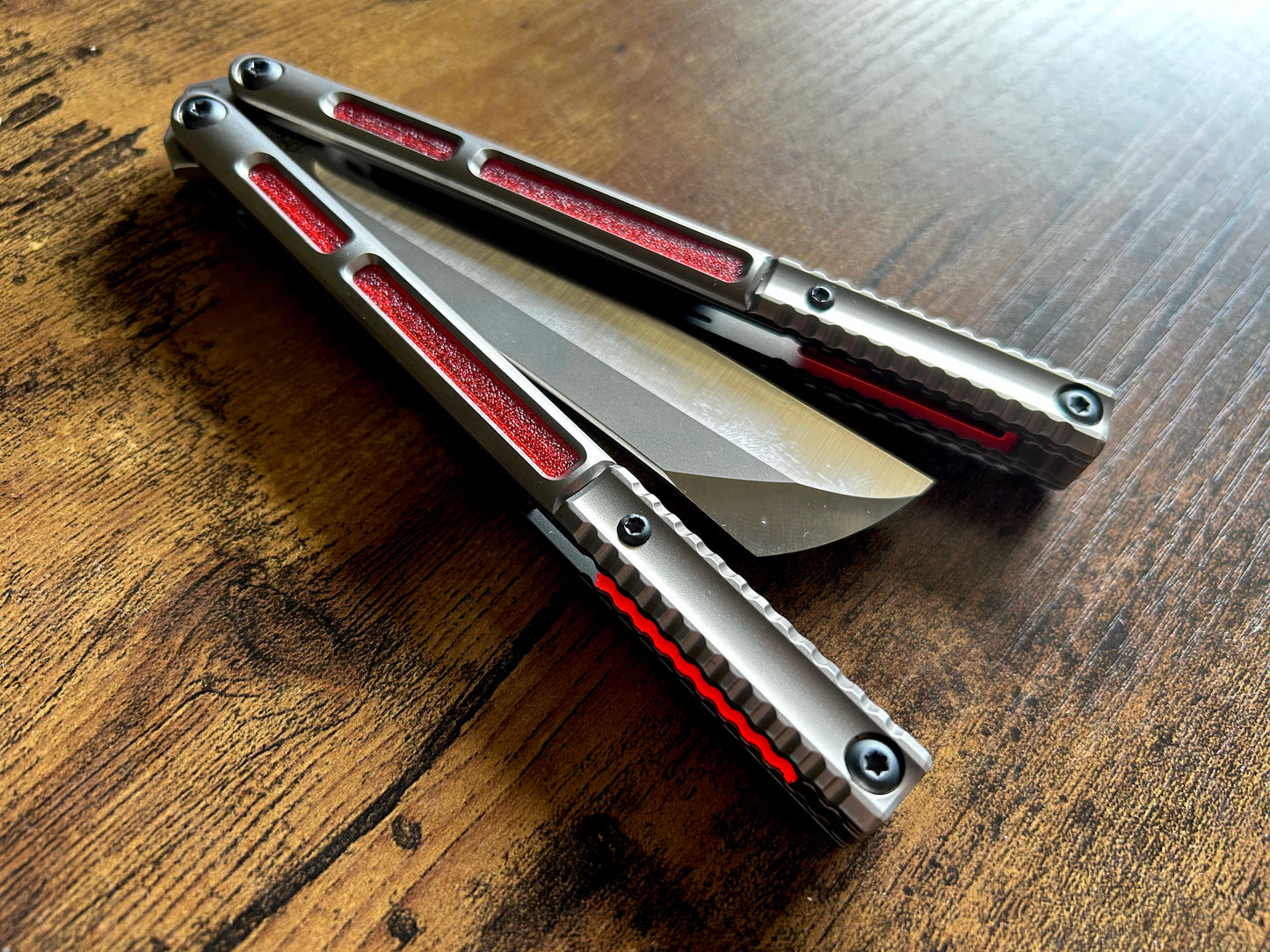 These Zippy speed channel inserts are custom-designed for the Andrew Myers Knife Works (AMKW) Aeon butterfly knife They add positive jimping to the Aeon for extra grip, deepen the sound, and dampen the ring.
