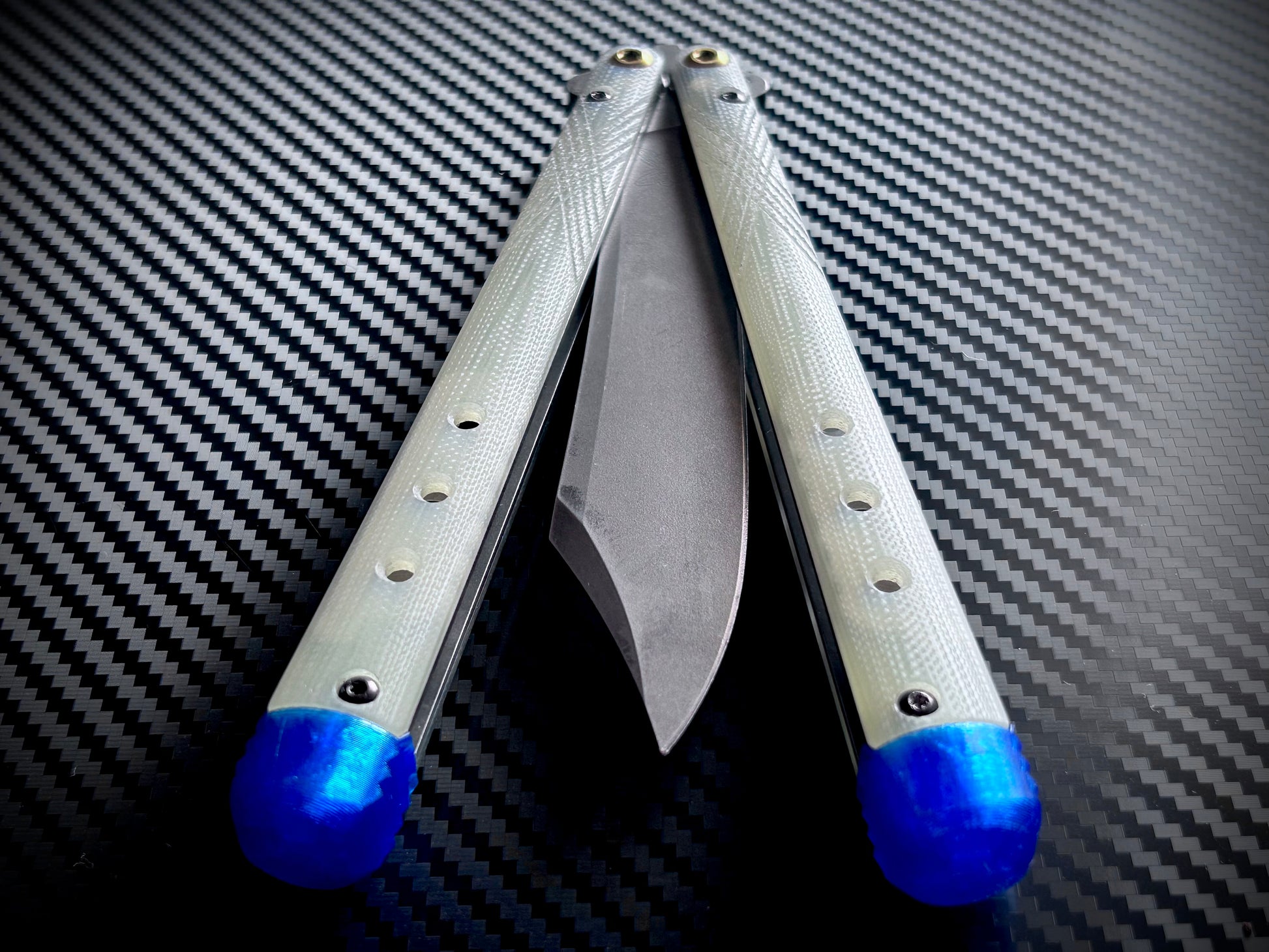 These Zippy spacers for the Benchmade Necron balisong are shatter-proof extensions that will protect your handles with no risk of cracking on hard-drops. They are available in 3x different lengths with removable tungsten weights for a more granular balance and length customization. They also offer positive jimping for extra grip, and install easily in just a few minutes (watch the assembly video above!). These spacers are a no-nonsense upgrade for the Necron.