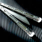 These Zippy spacers designed for the Fellowship Blades Gaboon and Invar Gaboon balisongs are made in-house from a rubbery, shatter-proof polyurethane. They add additional jimping to the Gaboon, provide a more neutral balance, and are also available as extensions which add handle length, protect the handles from drops, and include an adjustable tungsten weight system.