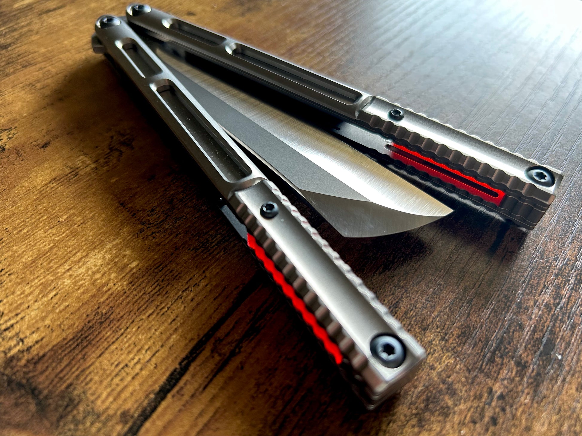 These Zippy speed channel inserts are custom-designed for the Andrew Myers Knife Works (AMKW) Aeon butterfly knife They add positive jimping to the Aeon for extra grip, deepen the sound, and dampen the ring.