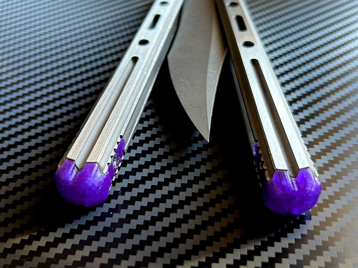 Extend and protect your handles with these Zippy spacers, custom-made for the Poikilo Blade PM3 (Halo) butterfly knife. The spacers are made from a shatter-proof polyurethane and protect your handles from drops while adding length. The spacers improve comfort. grip, and offer adjustable balance.