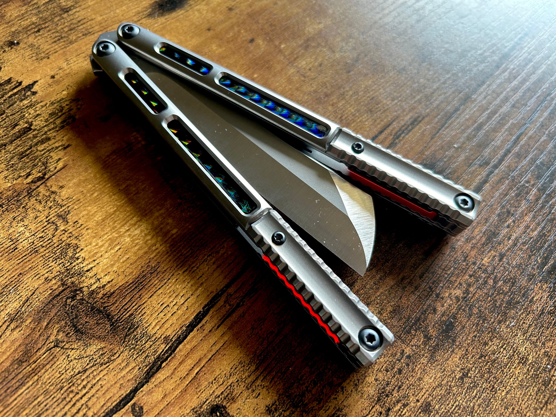 These Zippy speed channel inserts are custom-designed for the Andrew Myers Knife Works (AMKW) Aeon butterfly knife They add positive jimping to the Aeon for extra grip, deepen the sound, and dampen the ring.