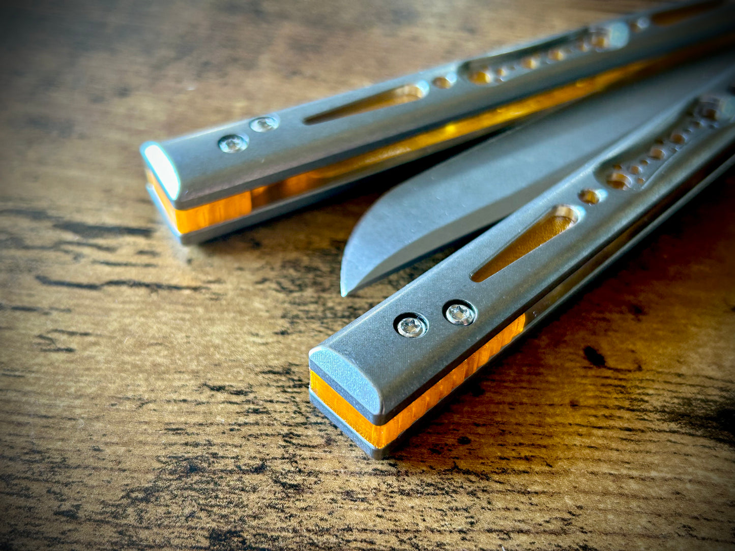 Modify the balance and ergo of your EPS Wraith Balisong with Zippy spacers, made in-house from a rubbery, shatter-proof polyurethane. Compatible with both G10 and Titanium variants. The spacers add positive "saw-tooth" jimping to the Wraith and include a tungsten weight system for adjustable balance. The spacers are available as either full-length flush spacers, or handle extensions which add length and protect the handles from drops.