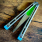 Designed and manufactured by Zippy, these are the stock spacers included with each Remshi Shino butterfly knife trainer. This listing allows you to customize your Remshi Shino with different spacer lengths and colors. These spacers are made in-house from a rubbery, shatter-proof polyurethane. They add grip and enable you to adjust the balance of your Shino. Choose from the stock OEM 5.75" Extension Spacers, or make your Shino shorter with either 5.69" Extensions or Flush Spacers.