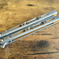 Modify the balance and ergo of your EPS Wraith Balisong with Zippy spacers, made in-house from a rubbery, shatter-proof polyurethane. Compatible with both G10 and Titanium variants. The spacers add positive "saw-tooth" jimping to the Wraith and include a tungsten weight system for adjustable balance. The spacers are available as either full-length flush spacers, or handle extensions which add length and protect the handles from drops.