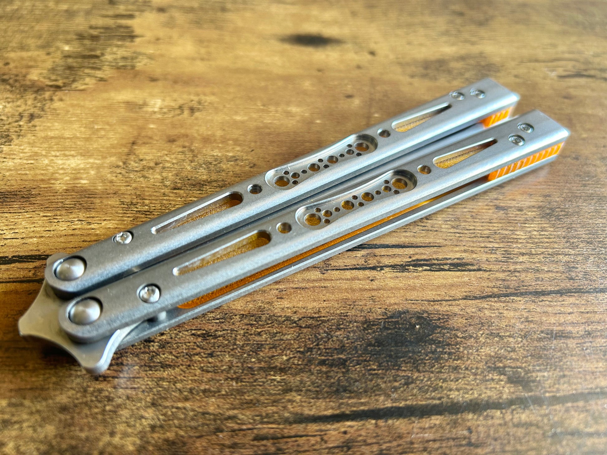 Modify the balance and ergo of your EPS Wraith Balisong with Zippy spacers, made in-house from a rubbery, shatter-proof polyurethane. Compatible with both G10 and Titanium variants. The spacers add positive "saw-tooth" jimping to the Wraith and include a tungsten weight system for adjustable balance. The spacers are available as either full-length flush spacers, or handle extensions which add length and protect the handles from drops.