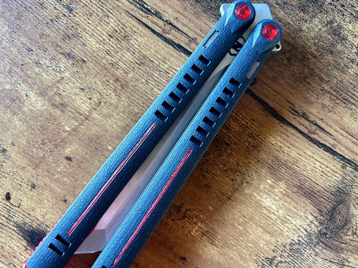 Want to kit out your Zippy Parallax butterfly knife with a different aesthetic? Look no further. This listing allows you to customize your balisong with different colored handle inlays and pivot caps. These cosmetic inlays are made in-house from a rubbery, shatter-proof polyurethane.