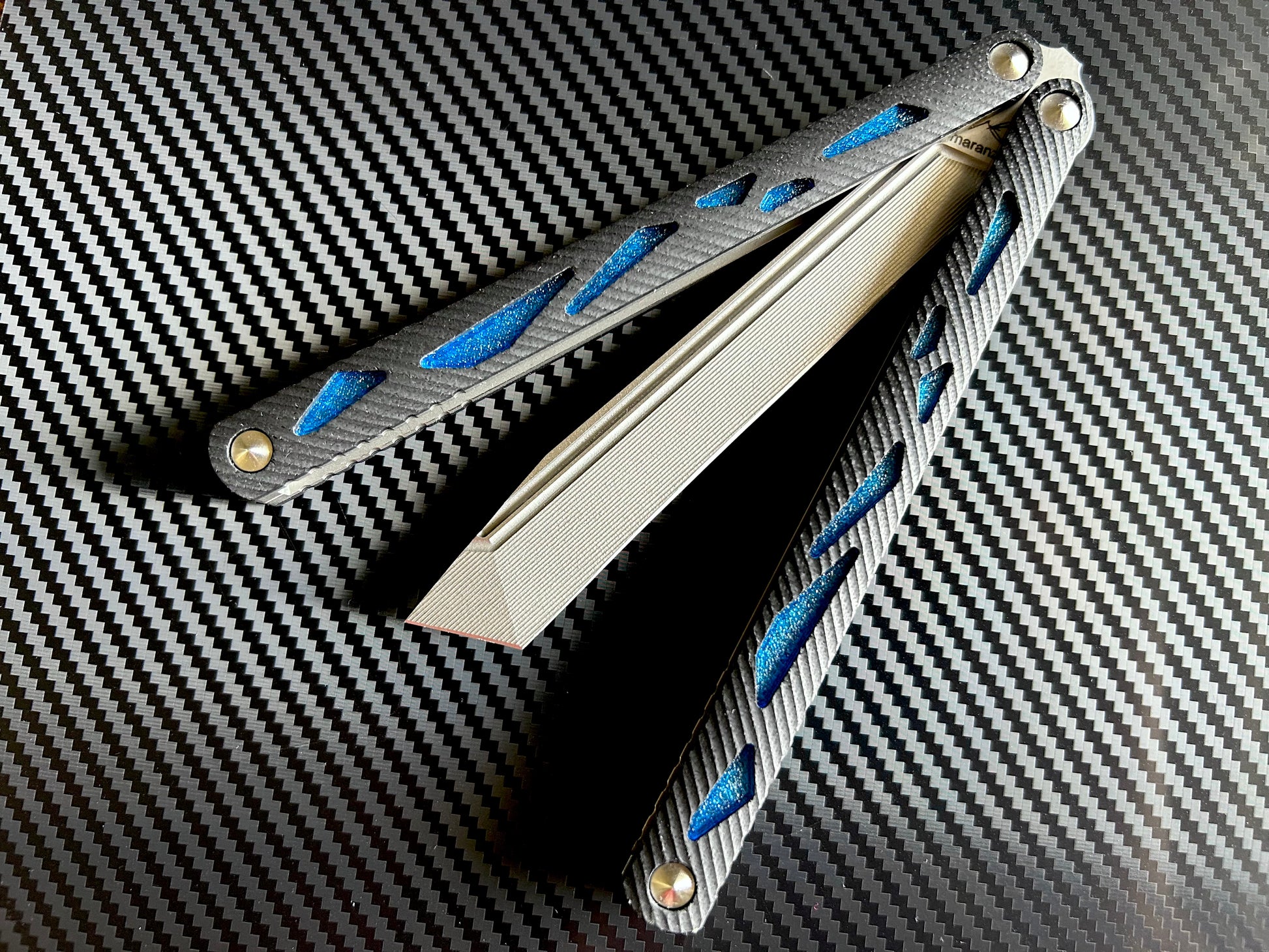 These cosmetic Zippy handle inlays are designed for the Maranza Zika butterfly knife and add a pop of color without changing the balance. The Maranza Zika balisong is a collaboration between AcidWRX and Ceroni Knives, and now it has aftermarket support from Zippy.
