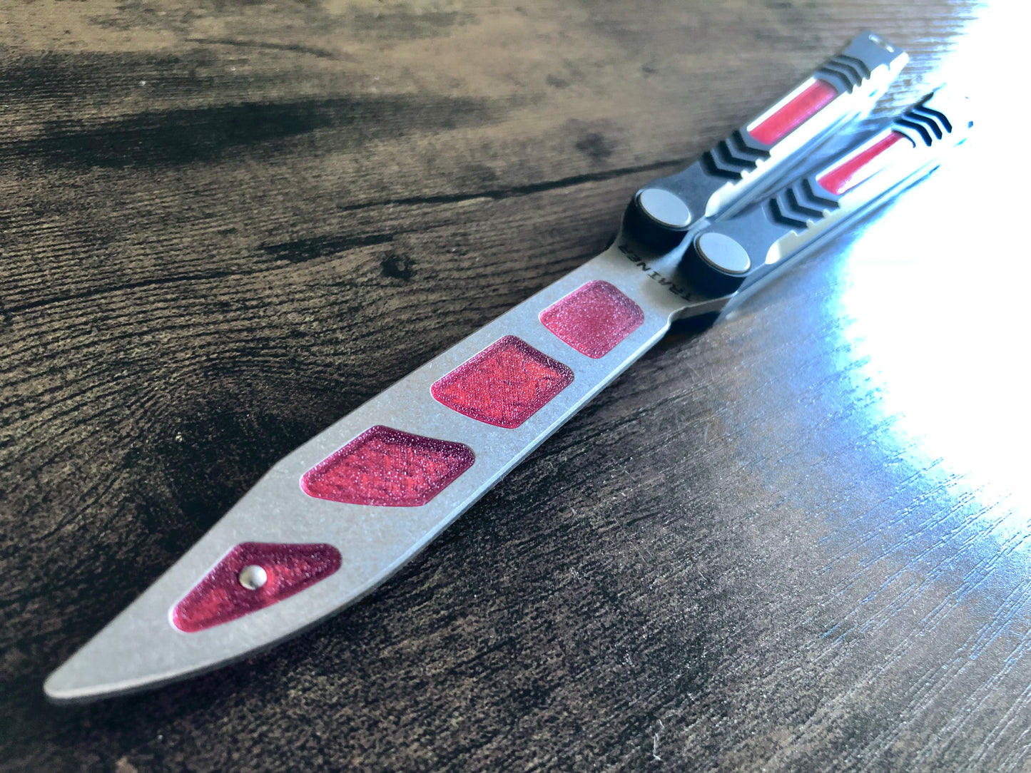 Modify the balance of your Revo Nexus balisong trainer with this custom-made Zippy balance mod. These inserts add blade weight for a more neutral balance profile. The inserts are made from a shatter-proof polyurethane and won't fall out on drops.