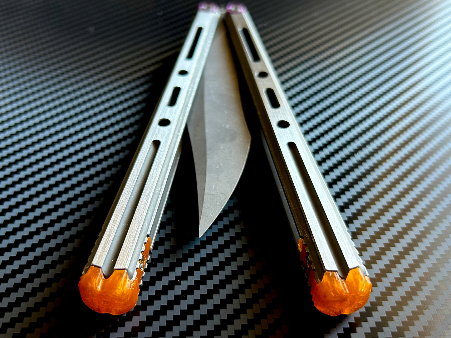 Extend and protect your handles with these Zippy spacers, custom-made for the Poikilo Blade PM3 (Halo) butterfly knife. The spacers are made from a shatter-proof polyurethane and protect your handles from drops while adding length. The spacers improve comfort. grip, and offer adjustable balance.