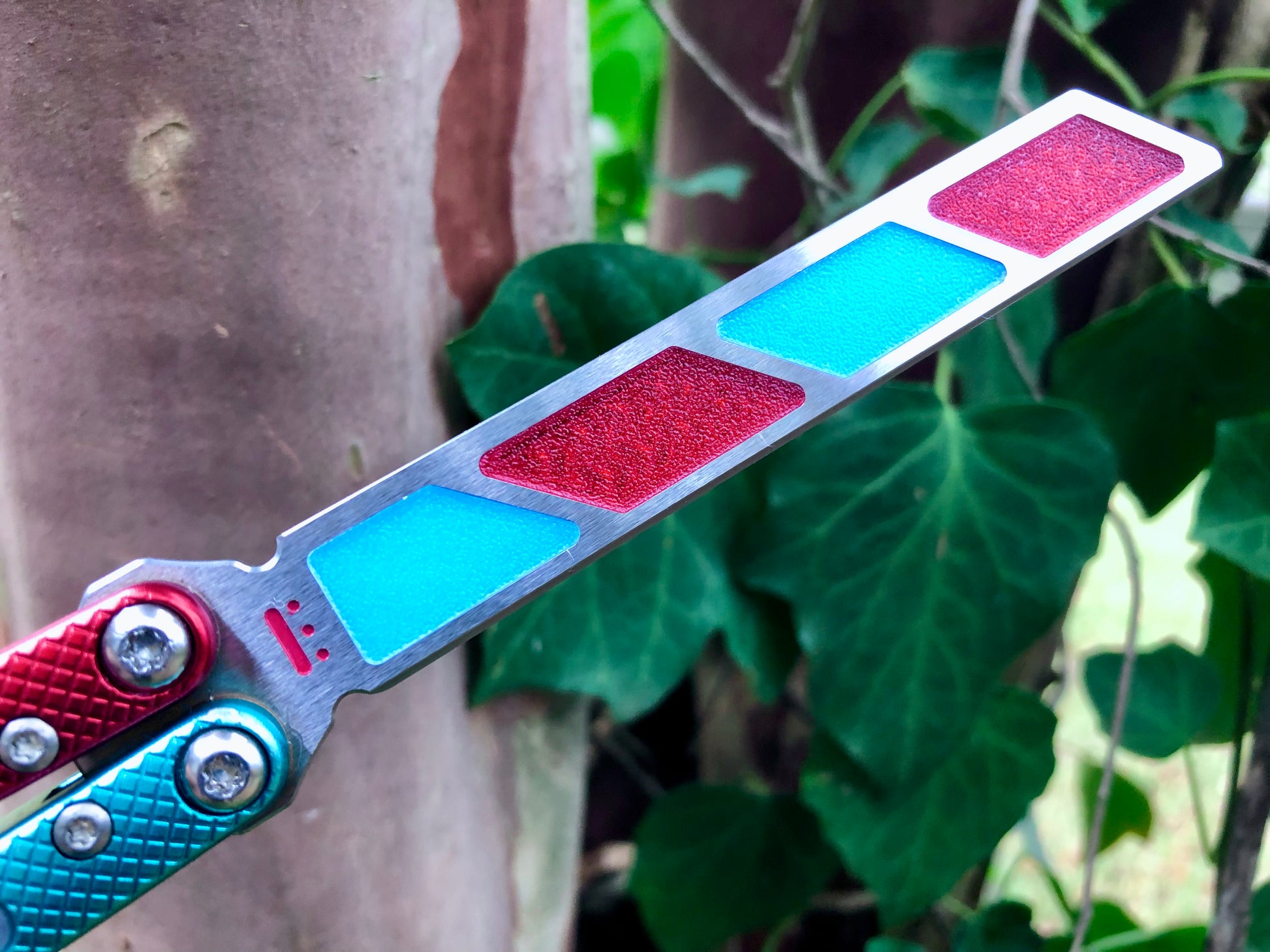 Add blade weight and a pop of color to your NRB Ultralight balisong trainer with these custom-made Zippy blade inserts. The inserts are made of a shatter-proof polyurethane with an edge lip, so they won't fall out on drops. The inserts enable you to modify the balance of your Ultralight and can be used to compensate for the added handle weight from the Zippy handle inlays.