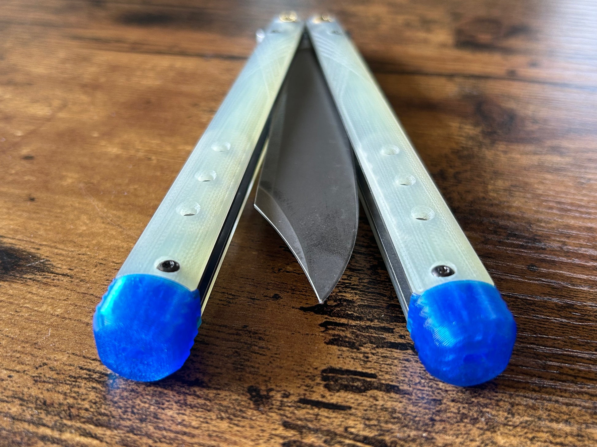 These Zippy spacers for the Benchmade Necron balisong are shatter-proof extensions that will protect your handles with no risk of cracking on hard-drops. They are available in 3x different lengths with removable tungsten weights for a more granular balance and length customization. They also offer positive jimping for extra grip, and install easily in just a few minutes (watch the assembly video above!). These spacers are a no-nonsense upgrade for the Necron.