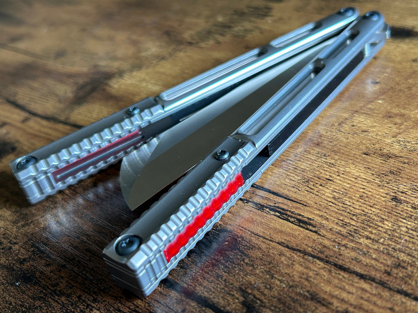 These Zippy speed channel inserts are custom-designed for the Andrew Myers Knife Works (AMKW) Aeon butterfly knife They add positive jimping to the Aeon for extra grip, deepen the sound, and dampen the ring.