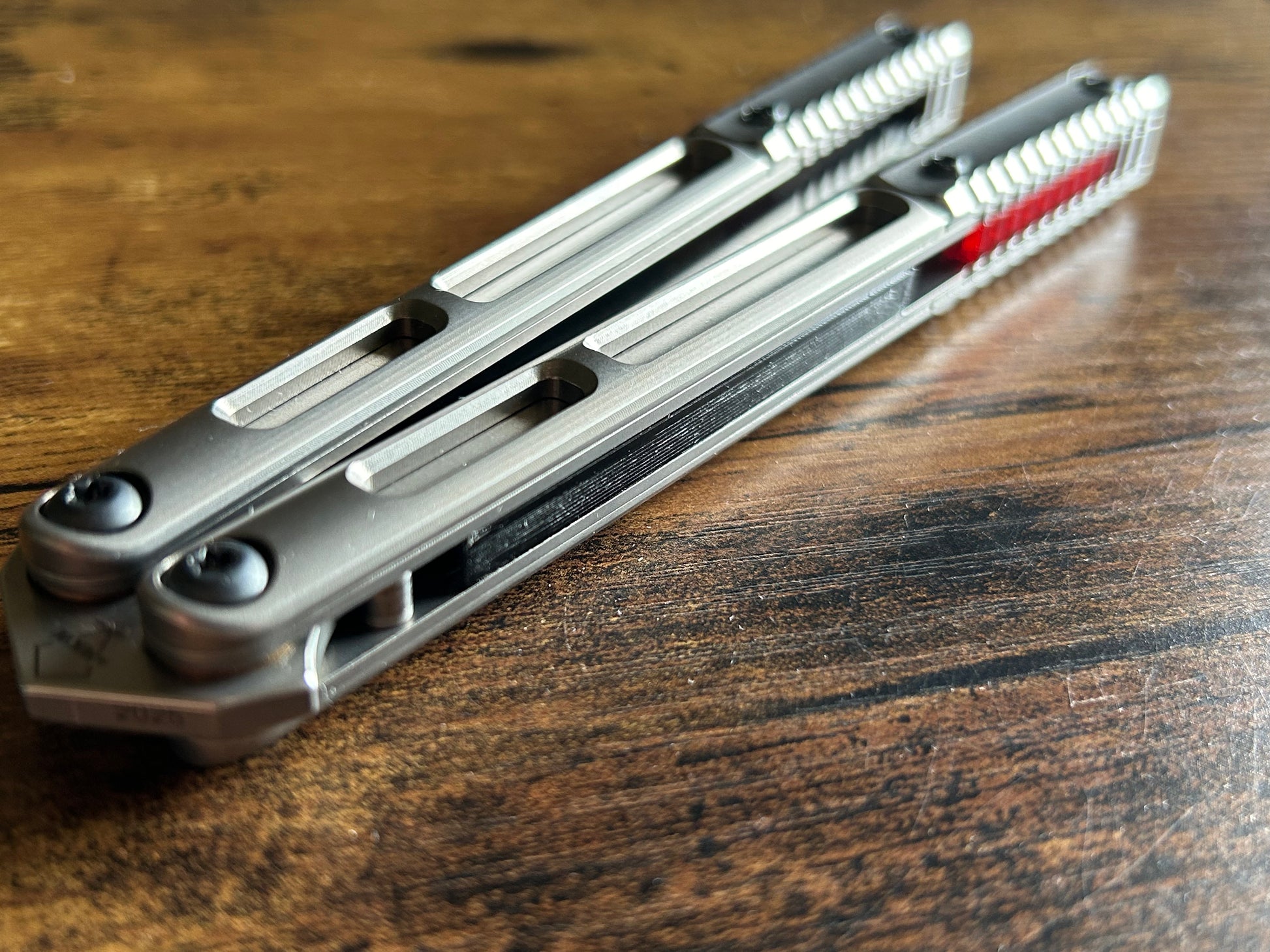 These Zippy speed channel inserts are custom-designed for the Andrew Myers Knife Works (AMKW) Aeon butterfly knife They add positive jimping to the Aeon for extra grip, deepen the sound, and dampen the ring.