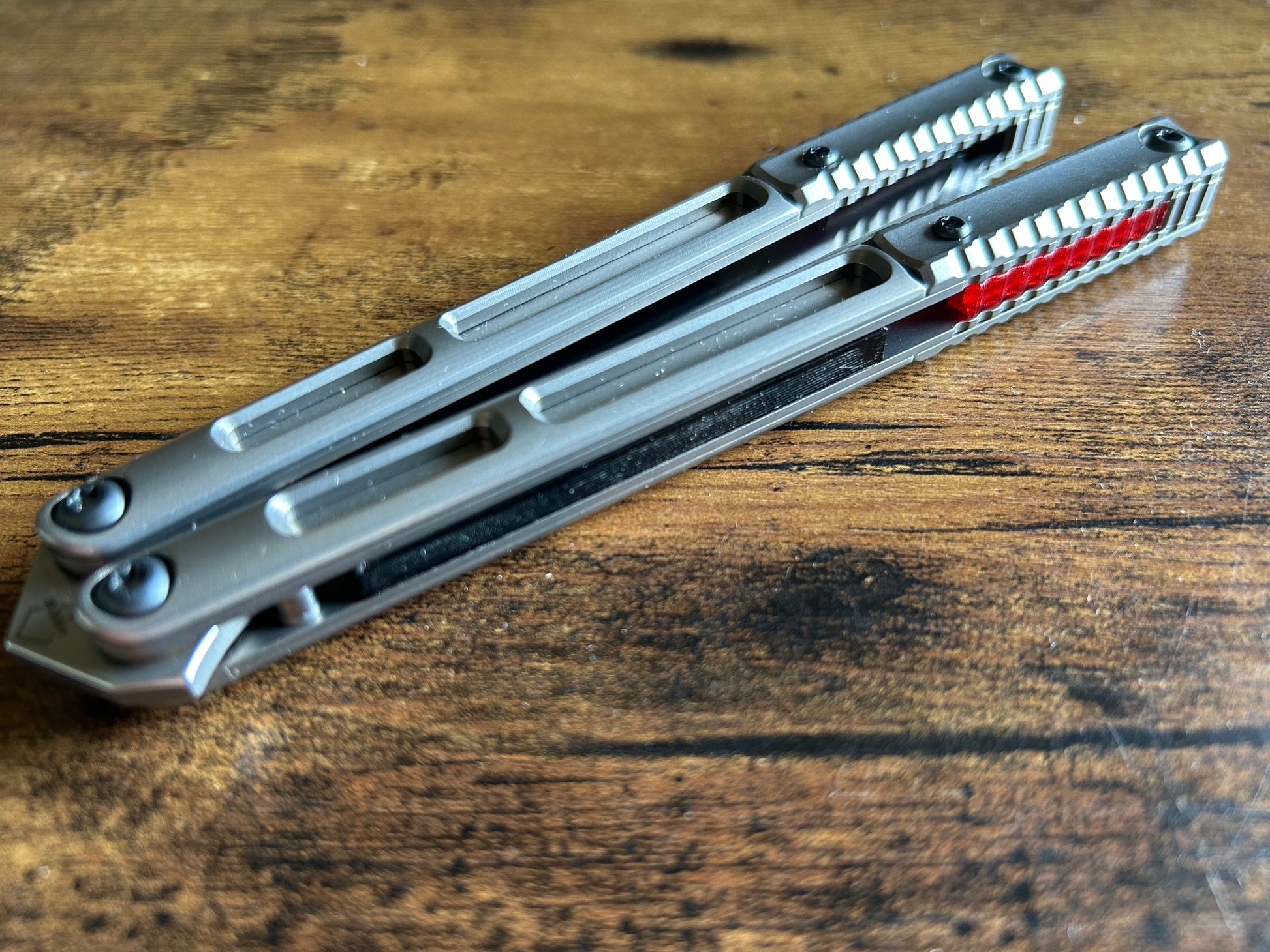 These Zippy speed channel inserts are custom-designed for the Andrew Myers Knife Works (AMKW) Aeon butterfly knife They add positive jimping to the Aeon for extra grip, deepen the sound, and dampen the ring.