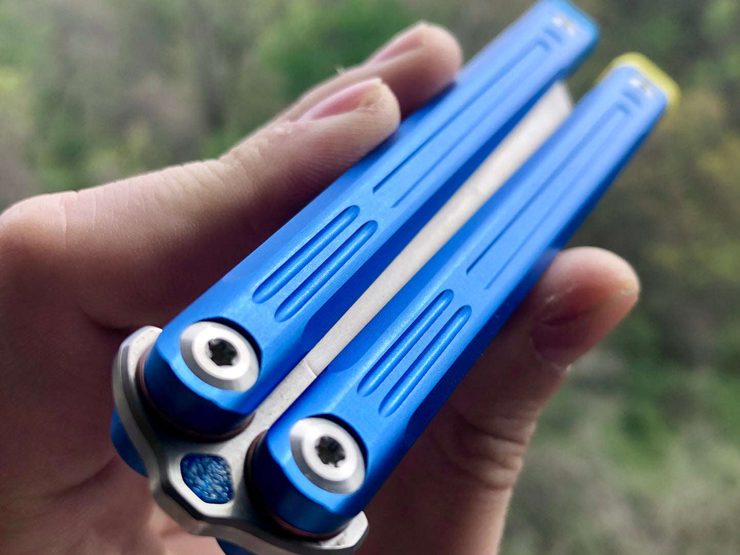 Adjust the balance, extend the handles, and add grip to your LDY balisong Cygnus and Orion flippers with Zippy extension spacers and handle inlays.
