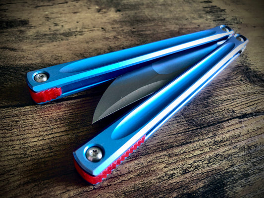 These Zippy spacers designed for the JK Design Embargo Balisong are made in-house from a rubbery, shatter-proof polyurethane. They add positive "saw-tooth" jimping to the Embargo and include a tungsten weight system for adjustable balance.