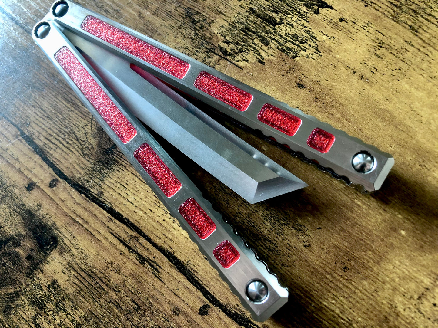 Modify the ergo, deepen the sound, and add a pop of color to your B.A. Balis Tesseract balisong with these polyurethane Zippy handle inlays.