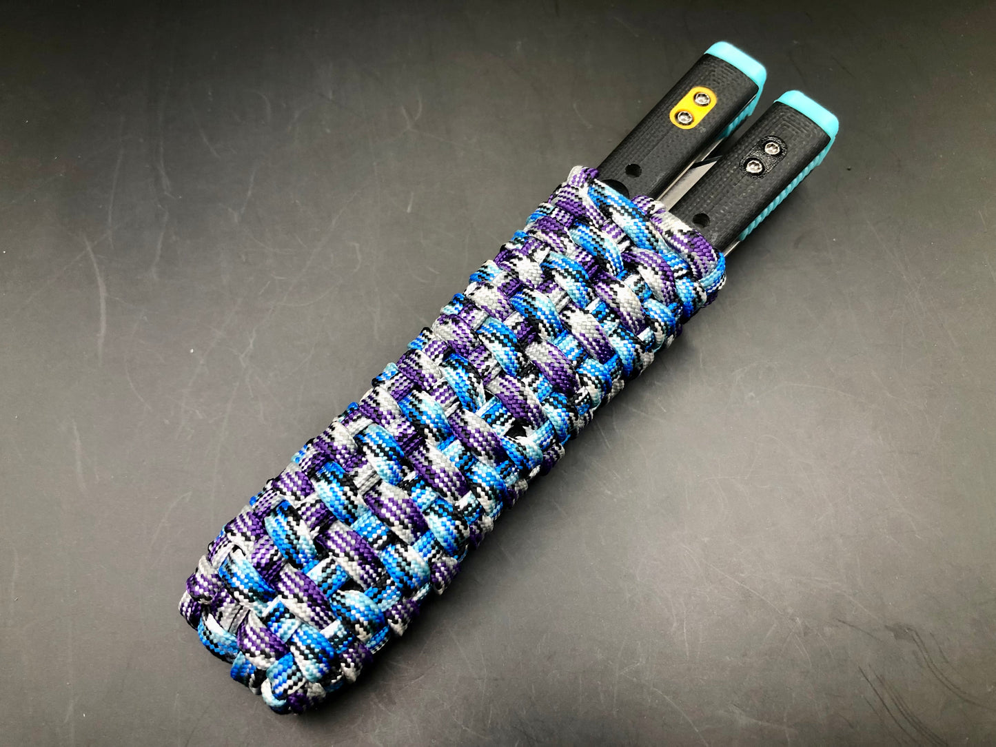 These handmade paracord slips made by @BalisongSlips on Instagram offer a functional way to pocket-carry your favorite EDC balisong while protecting your fingers, your balisong, and everything else in your pocket.