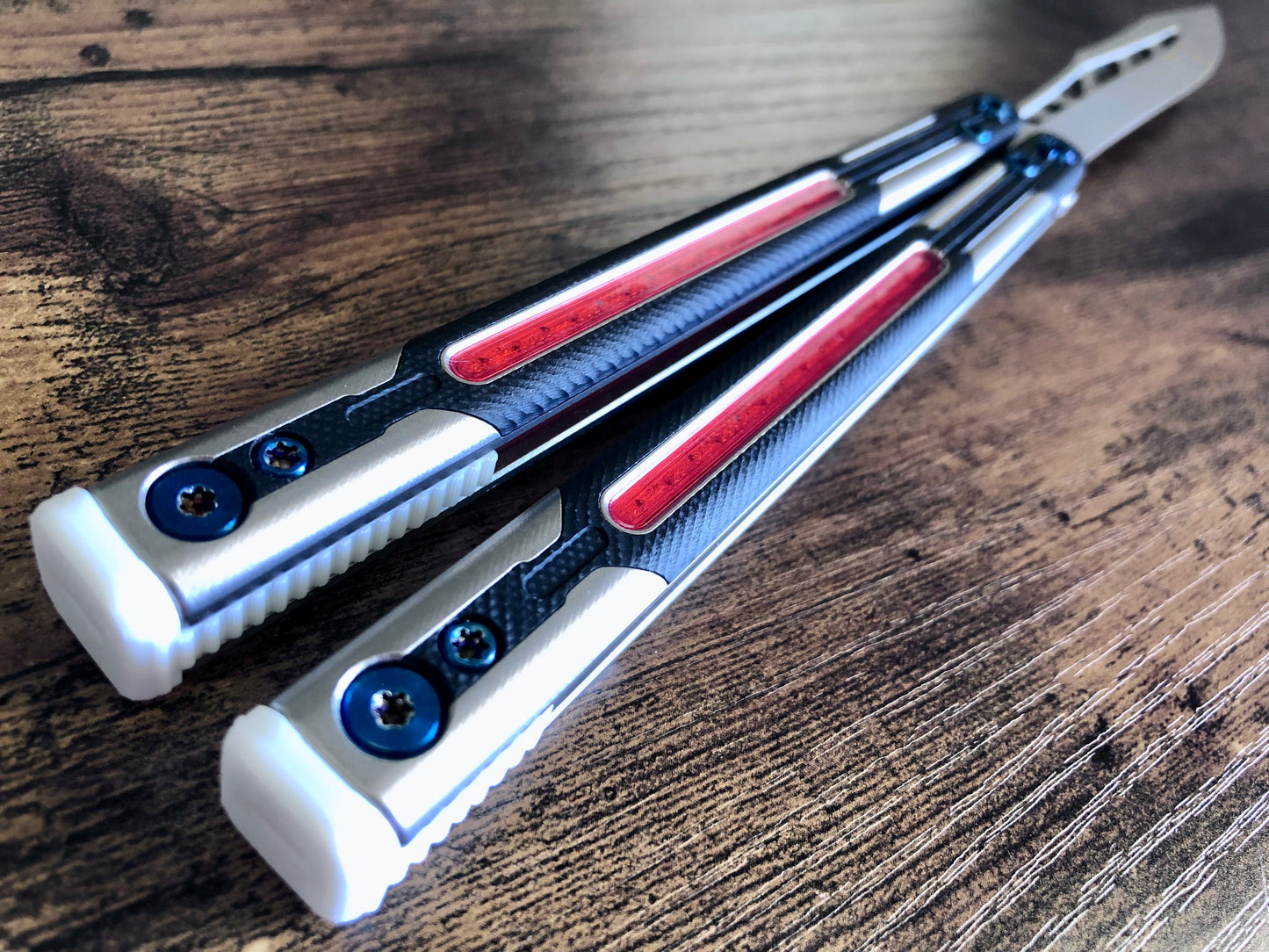 Adjust the balance, extend the handles, and add grip to your LDY balisong Cygnus and Orion flippers with Zippy extension spacers and handle inlays.